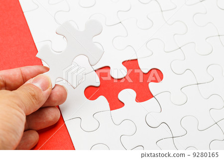 Incomplete puzzle with missing piece on human hand 9280165