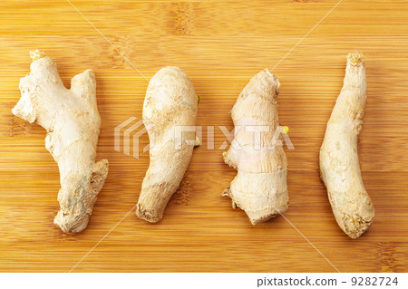 Ginger on wooden table 9282724