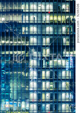 Modern office building at night 9286506