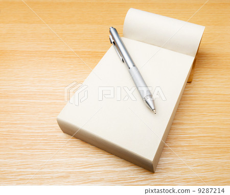 Memo pad and pen on the table 9287214