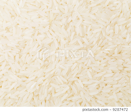 Uncooked white rice close up Uncooked white rice close up 9287472