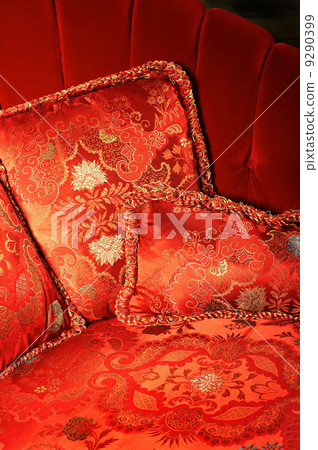 Red pillow with an ornament 9290399