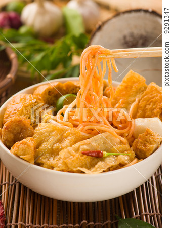 singapore laksa curry noodles with plenty of raw ingredients as 9291347