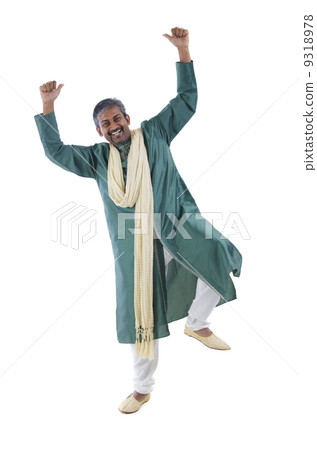 Indian male dancer performs folk dance 9318978