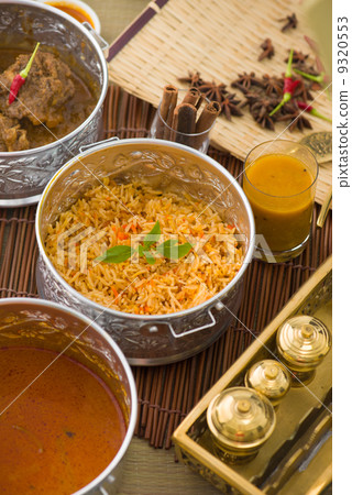 Biryani mutton rice papadam with traditional background Biryani mutton rice papadam with traditional background 9320553