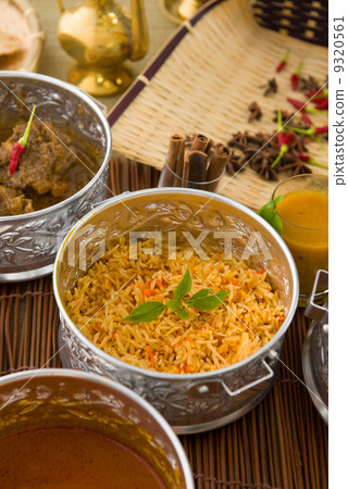 Biryani mutton rice with traditional background Biryani mutton rice with traditional background 9320561