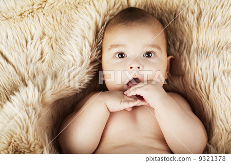 cute baby portrait lying on fur cute baby portrait lying on fur 9321378