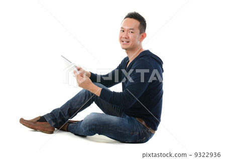 asian chinese man with a tablet in casual asian chinese man with a tablet in casual 9322936