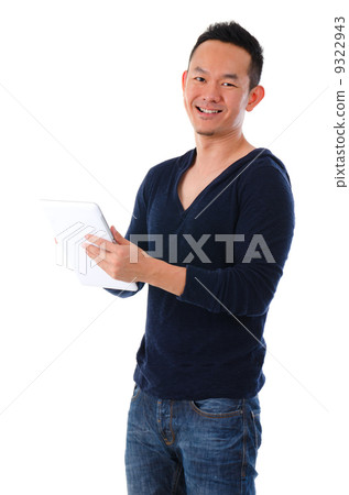happy asian male on a generic tablet happy asian male on a generic tablet 9322943