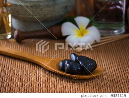 hot stone massage with spa treatment items on the background 9323819