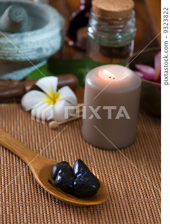 hot stone massage with spa treatment items on the background 9323822