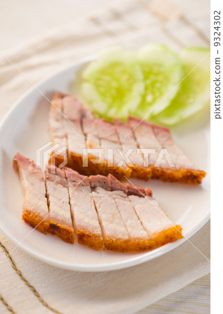 chinese roast pork close up shot served with chilli sauce chinese roast pork close up shot served with chilli sauce 9324302