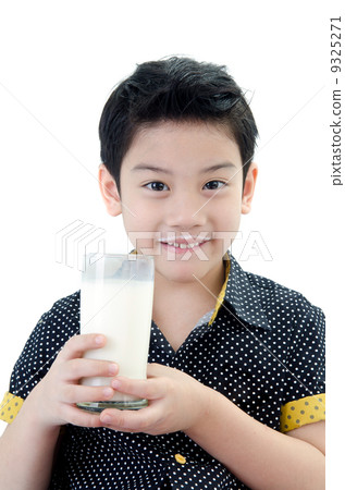 Portrait of Little asian boy drinking a glass of milk Portrait of Little asian boy drinking a glass of milk 9325271