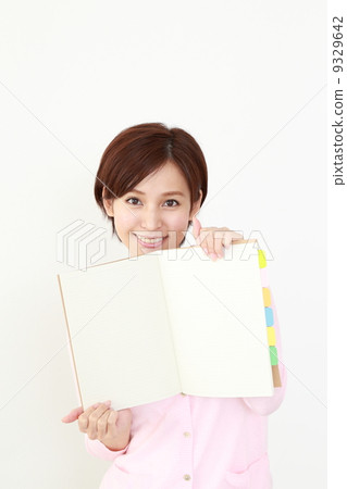 A woman showing a note A woman showing a note 9329642