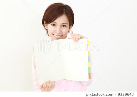 A woman showing a note A woman showing a note 9329643