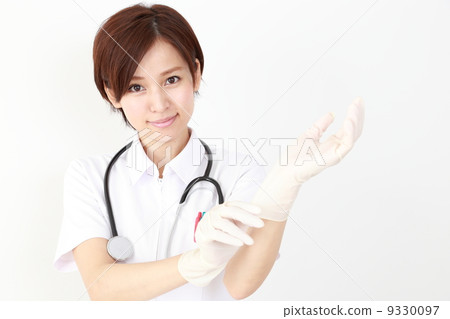 Doctor wearing a glove (nurse) 9330097