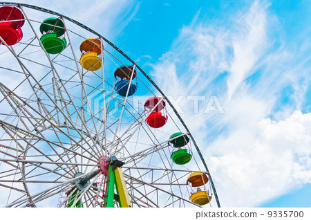 Colorful ferris wheel on blue sky background Colorful ferris wheel on blue sky background 9335700