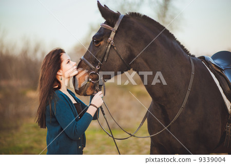 Young woman with a horse on nature Young woman with a horse on nature 9339004