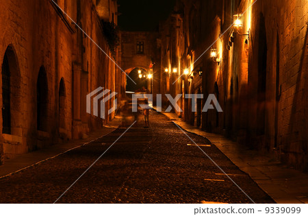 Medieval Avenue of the Knights at night, a cobblestone street in 9339099