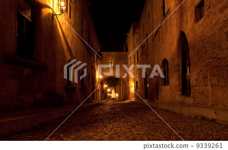 Medieval Avenue of the Knights at night, a cobblestone street in Rhodes Citadel , Greece 9339261