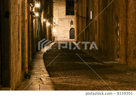 Medieval Avenue of the Knights at night, a cobblestone street in Rhodes Citadel , Greece Medieval Avenue of the Knights at night, a cobblestone street in Rhodes Citadel , Greece 9339301