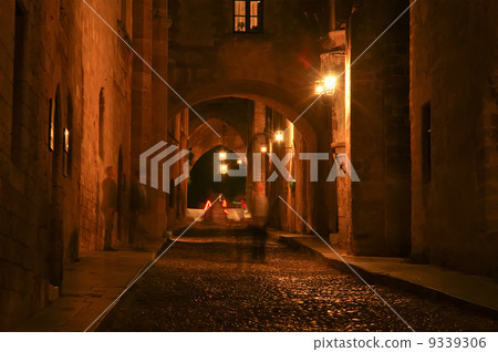 Medieval Avenue of the Knights at night, a cobblestone street in Rhodes Citadel , Greece 9339306