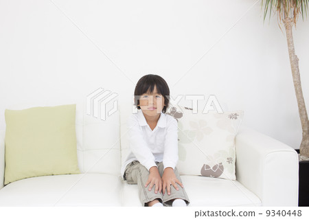 Elementary school student in the living room 9340448