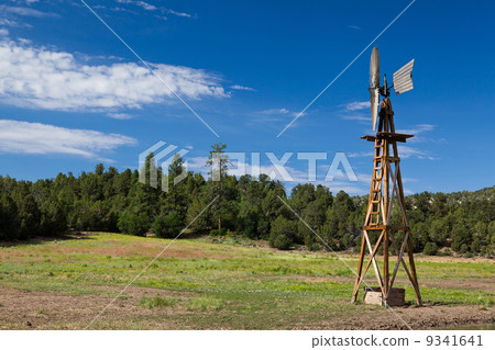 Old fashioned country windmill for pumping water 9341641