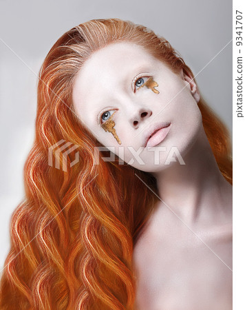 Harlequin. Artistic Red Hair Woman with Painted Face and Creative Makeup 9341707