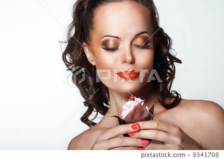 Gourmet. Woman Holding Unhealthy Food - Appetizing Chocolate Muffin Gourmet. Woman Holding Unhealthy Food - Appetizing Chocolate Muffin 9341708