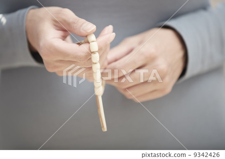 Hands with rosary beads 9342426