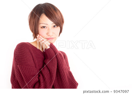 A girl who loves to squirrelly with his hands beside his cheeks A girl who loves to squirrelly with his hands beside his cheeks 9347097