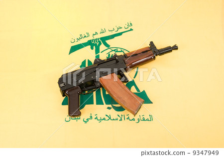 Automatic rifle and flag of Hezbollah 9347949