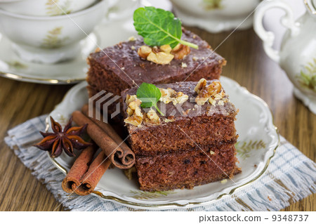 Slice of chocolate cake with nuts 9348737