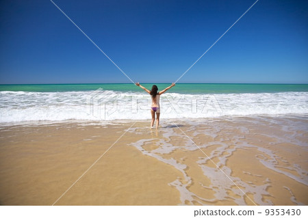 woman happy at seashore in Conil beach 9353430