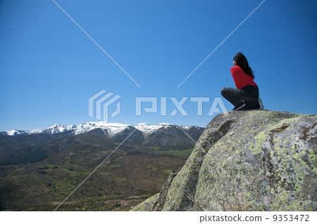 squatting at top of valley squatting at top of valley 9353472