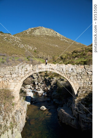 walking on ancient bridge 9353500