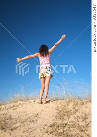 flying woman at beach 9353547