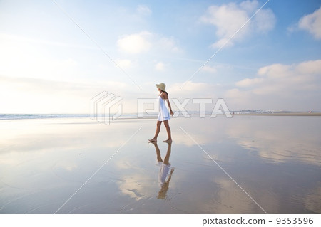 woman reflected on ocean 9353596