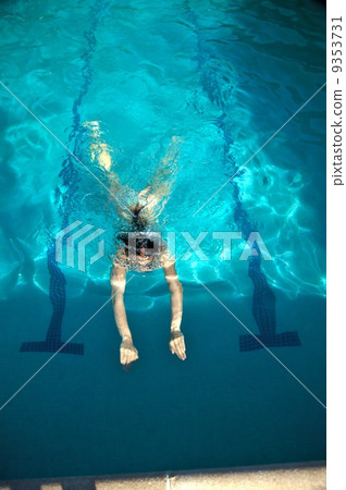 woman immerse in a pool woman immerse in a pool 9353731