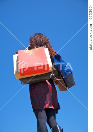 woman full of shopping bags 9353994