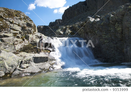 hiking woman next waterfall 9353999