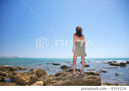 green dress woman on the rocks green dress woman on the rocks 9354129