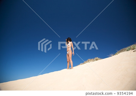 bikini woman watching 9354194