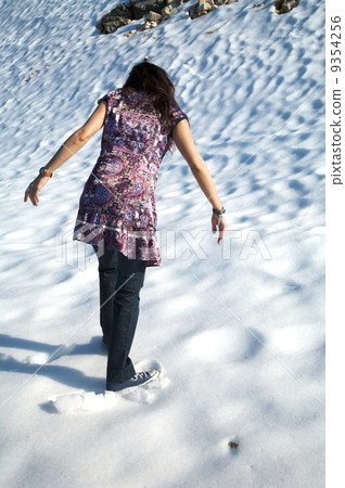 back woman at snow in salamanca 9354256