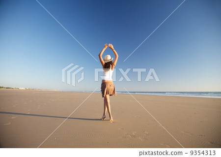 dancer woman with hat at beach 9354313