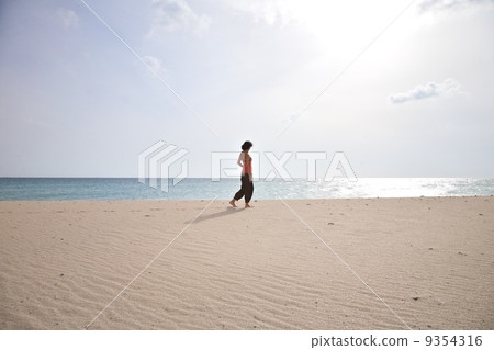 woman next ocean at Tarifa beach 9354316