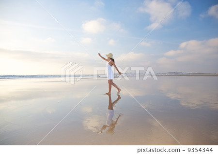 happy woman reflected on ground 9354344