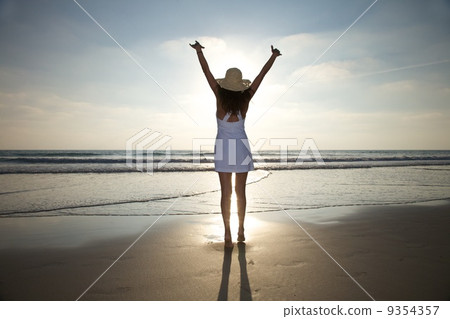 happy woman against sun 9354357