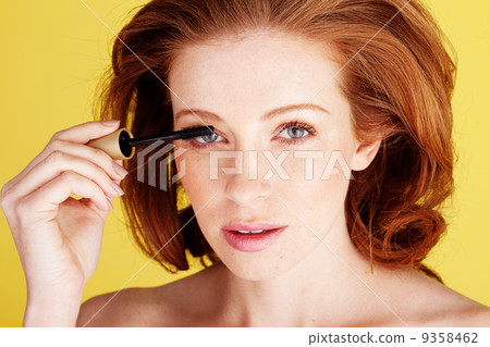 Pretty Woman Applying Mascara 9358462